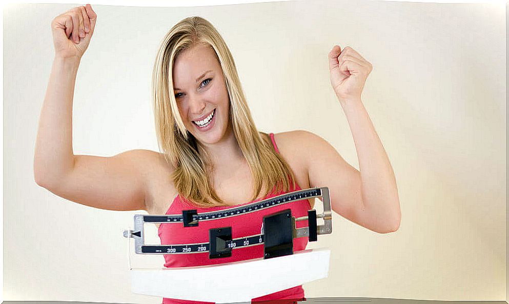 Woman measuring herself on a scale