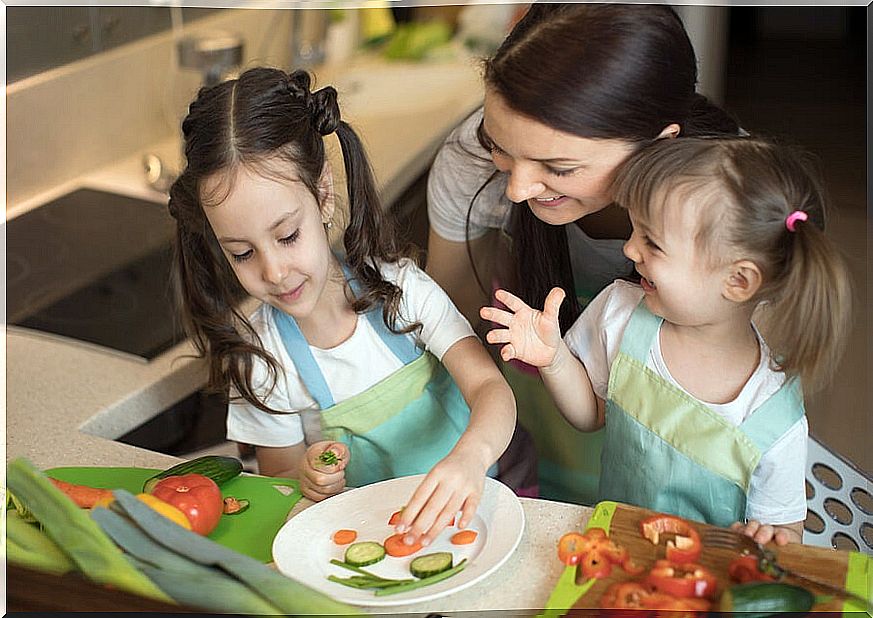 Girls with mom in the kitchen