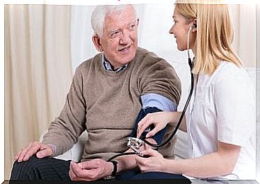 Nurse taking patient's blood pressure