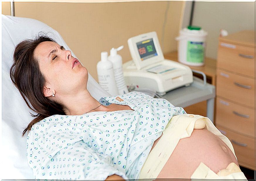 Woman in labor doing breathing exercises