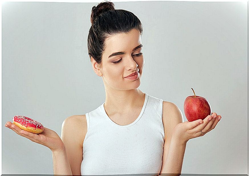 Girl with a donut and an apple.