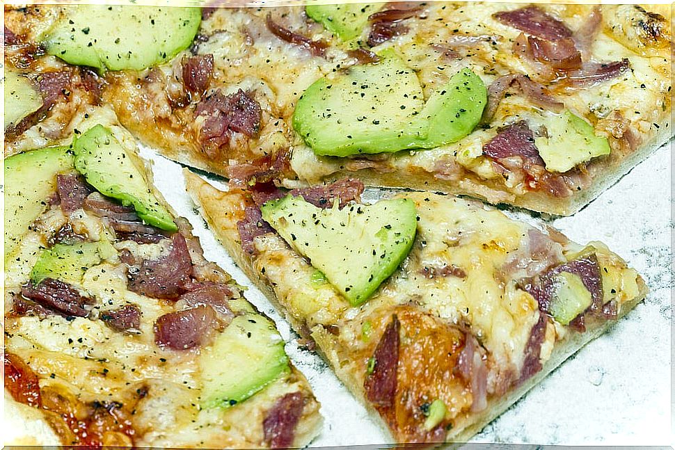 Pizza with avocado and serrano ham