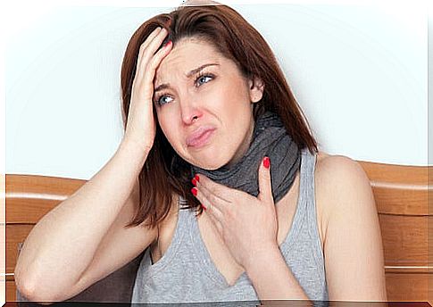 Woman touching her neck for throat discomfort